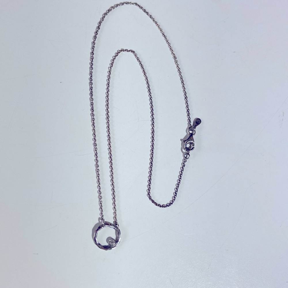 Silpada necklace. Round disc with clear stone.